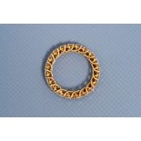 An 18 carat yellow gold ring set with twenty diamonds, 20th C.