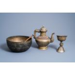 A Tibetan copper teapot, a healing bowl and a ritual bowl on foot, 19th/20th C.