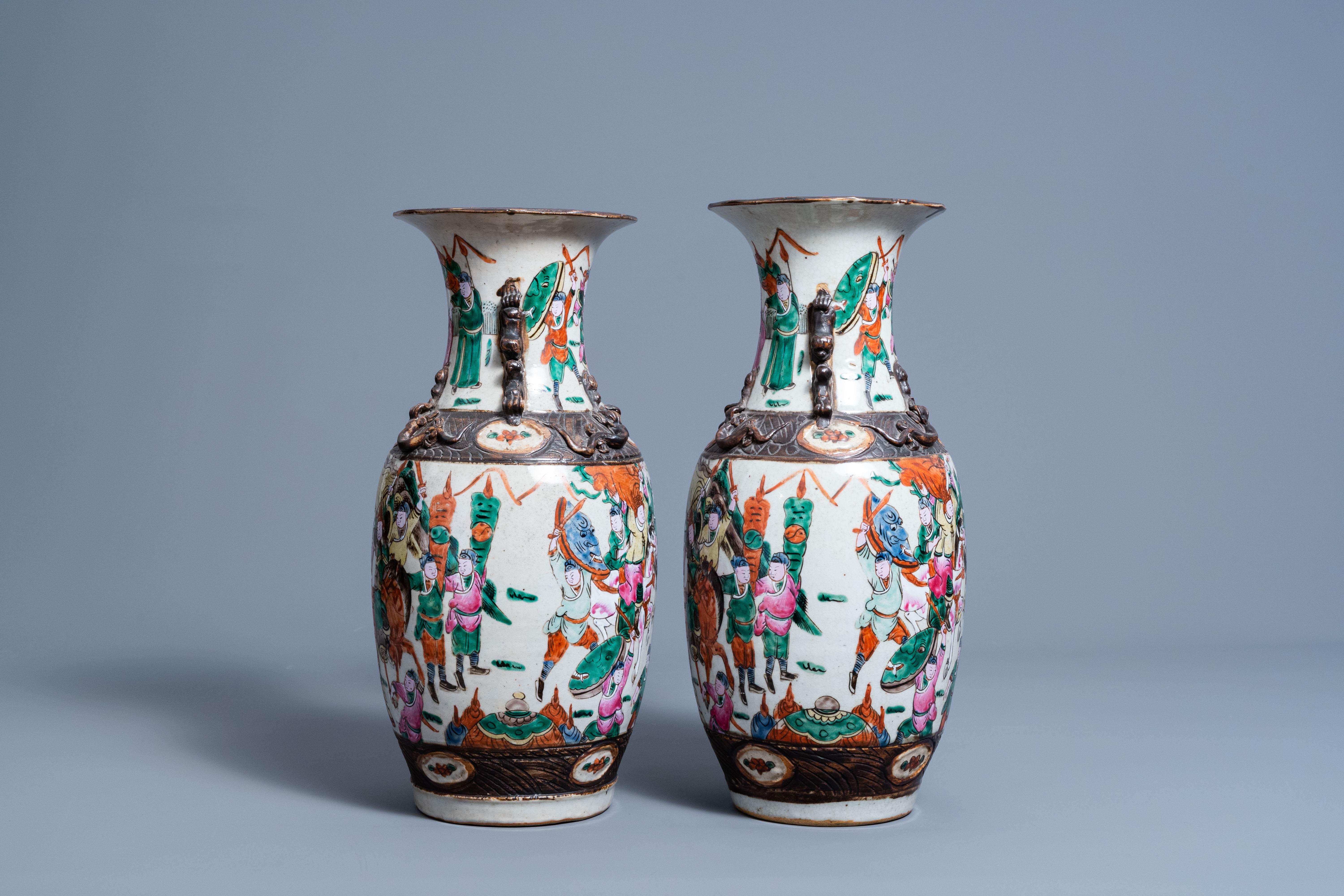 A pair of Chinese Nanking crackle glazed famille rose vases with warrior scenes, 19th C. - Image 4 of 6