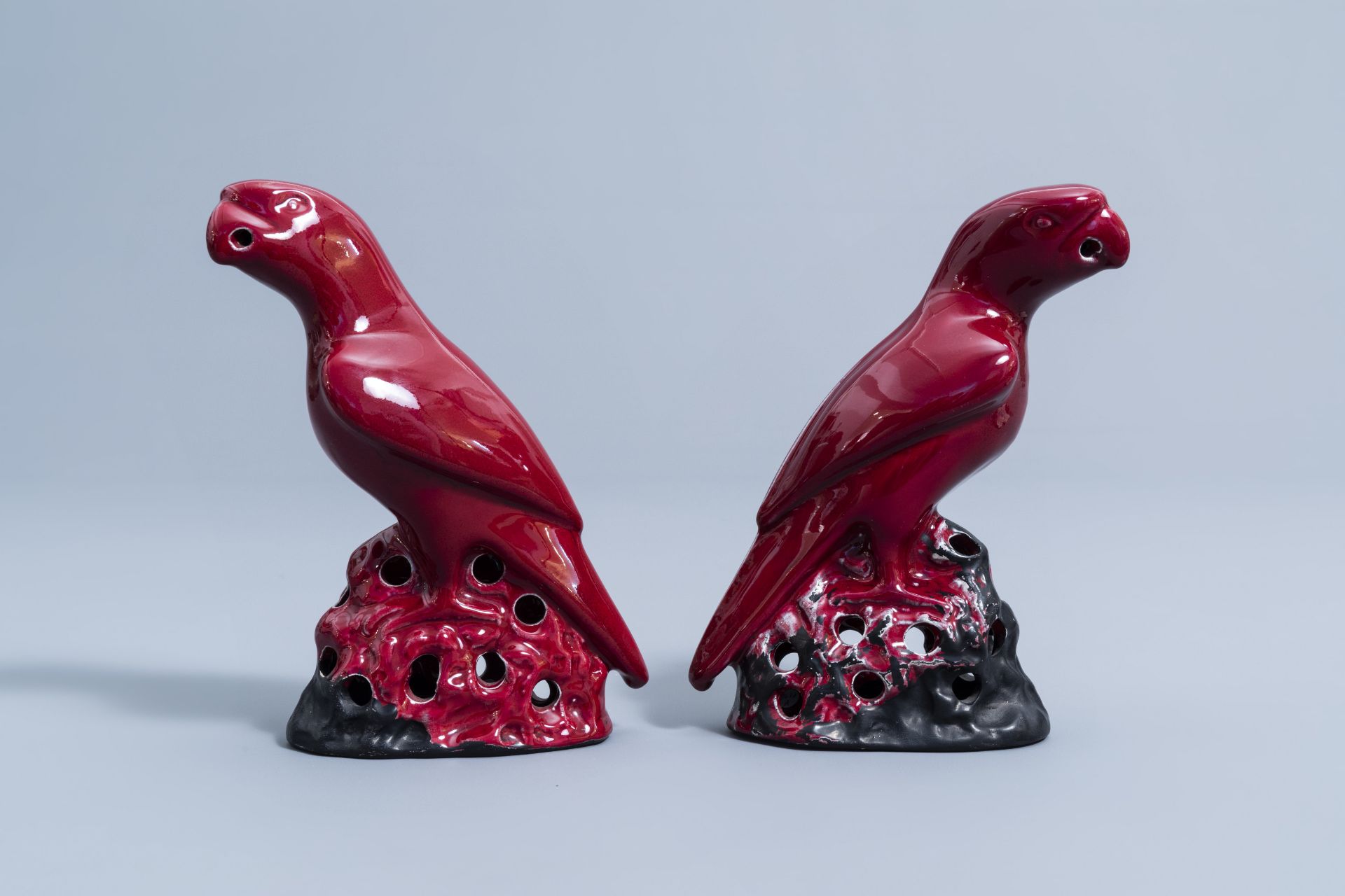 A pair of Chinese red glazed parrots and a monochrome red double gourd vase, 20th C. - Image 5 of 13
