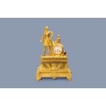 A large French gilt bronze mantel clock with on top a general, 19th C.