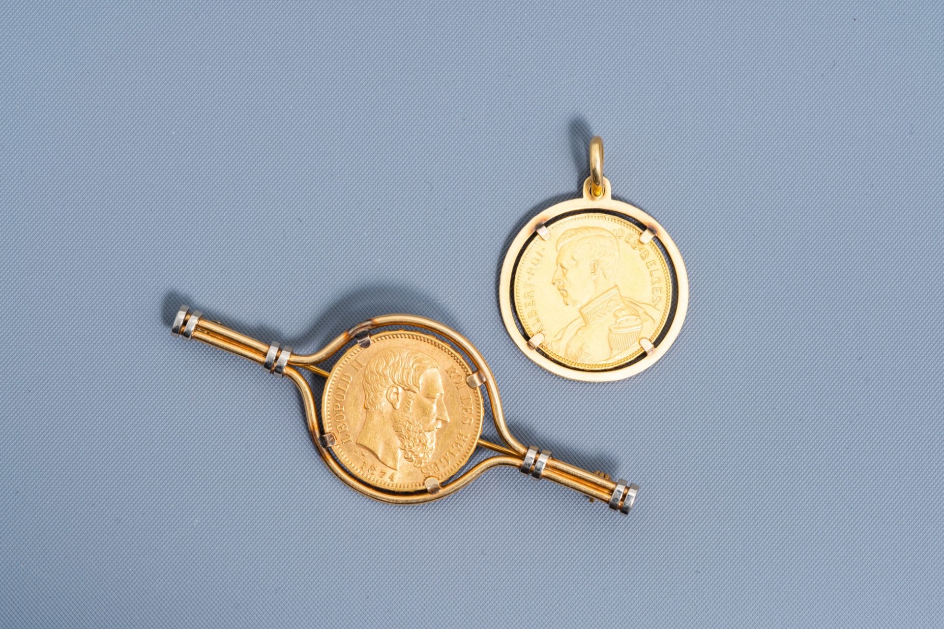 An 18 carat yellow gold pendant and a brooch set with a 1874 and 1914 Belgian 20 francs coin, 19th/2
