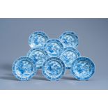 Eight Chinese blue and white saucer plates with an animated river landscape, Qianlong