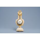 A French Neoclassical gilt bronze and white marble lyre clock, second half of the 19th C.