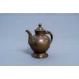 A Sino-Tibetan bronze ewer and cover, 17th/18th C.