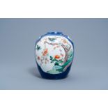 A Chinese famille verte powder blue grond jar with birds among blossoming branches, 19th C.