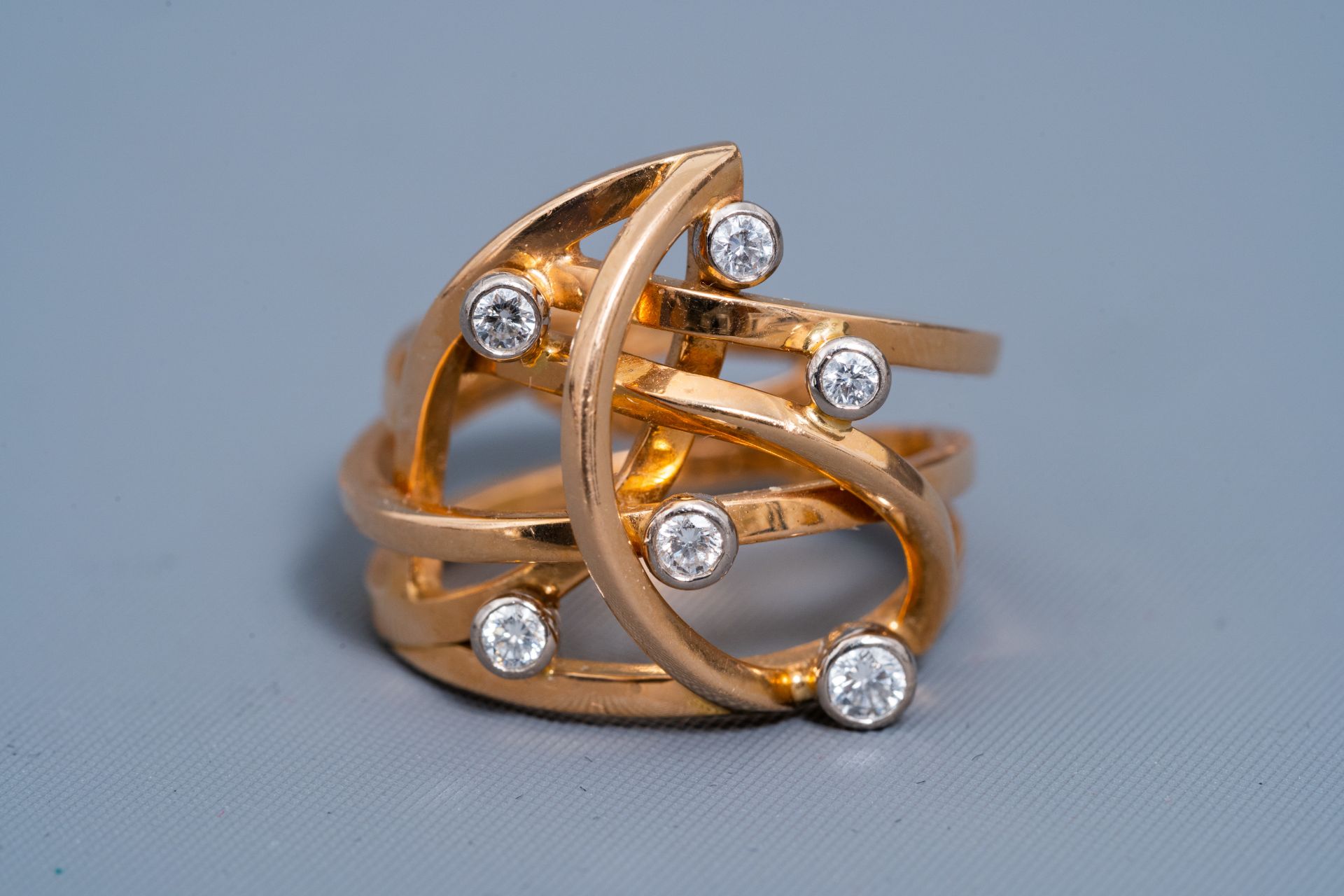 An 18 carat yellow and white gold ring set with six diamonds, 20th C. - Image 7 of 7