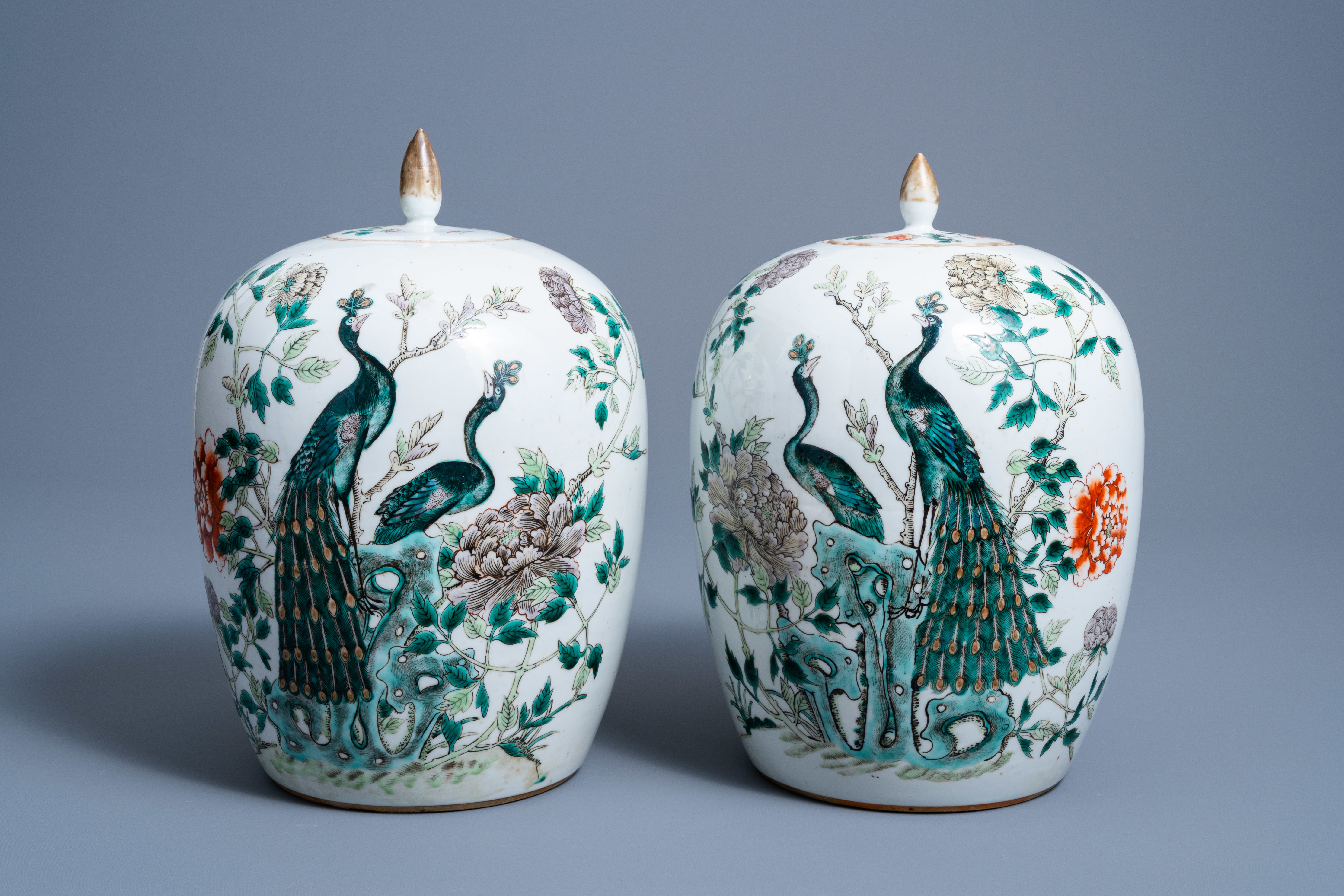 Two Chinese famille verte jars and covers with pheasants between blossoming branches, 19th C.