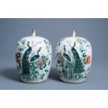 Two Chinese famille verte jars and covers with pheasants between blossoming branches, 19th C.