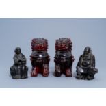 A pair of Chinese cherry resin Buddhist lions and two Chinese bronze figures, 19th/20th C.