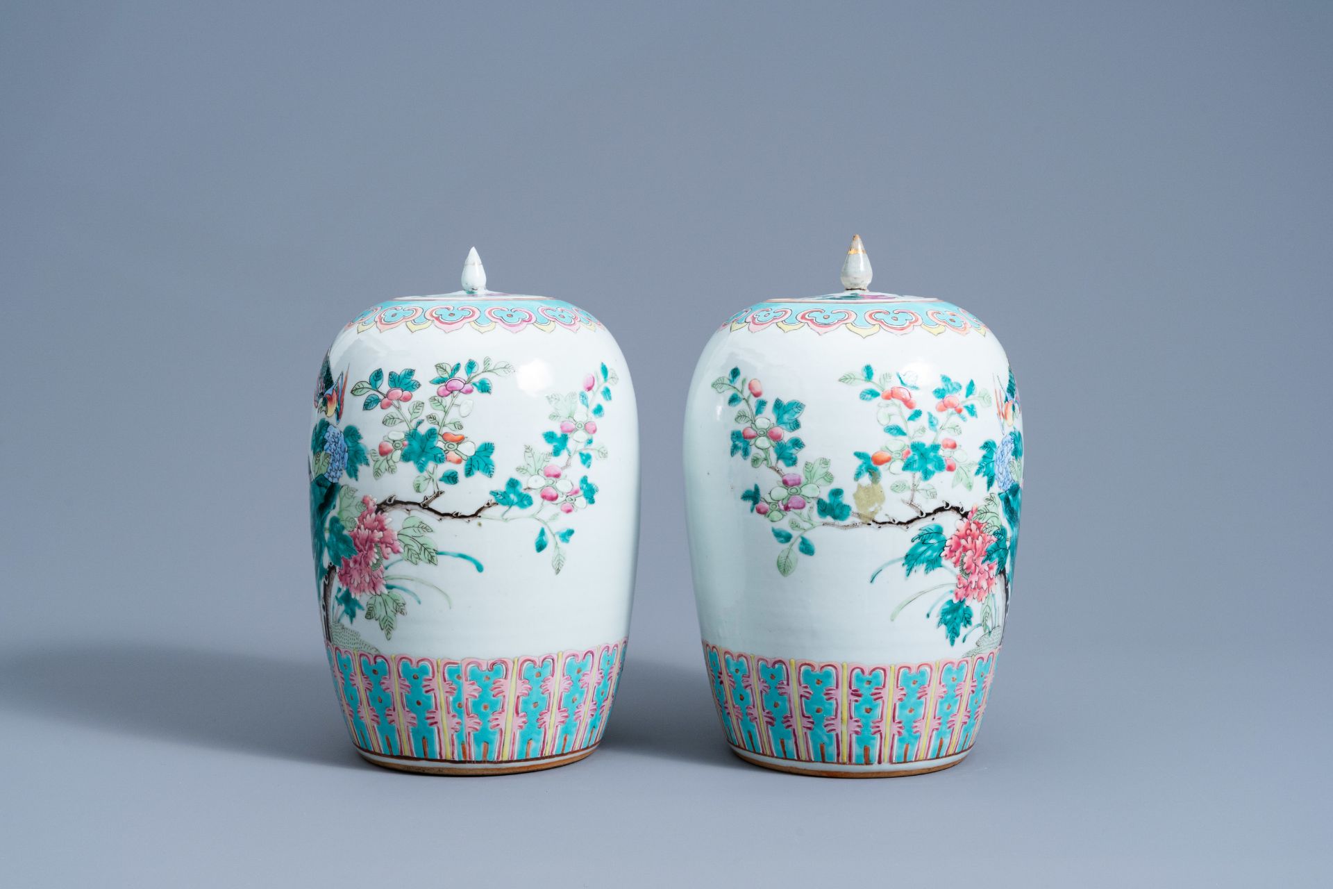 A pair of Chinese famille rose jars and covers with birds among blossoming branches, 19th C. - Image 4 of 10