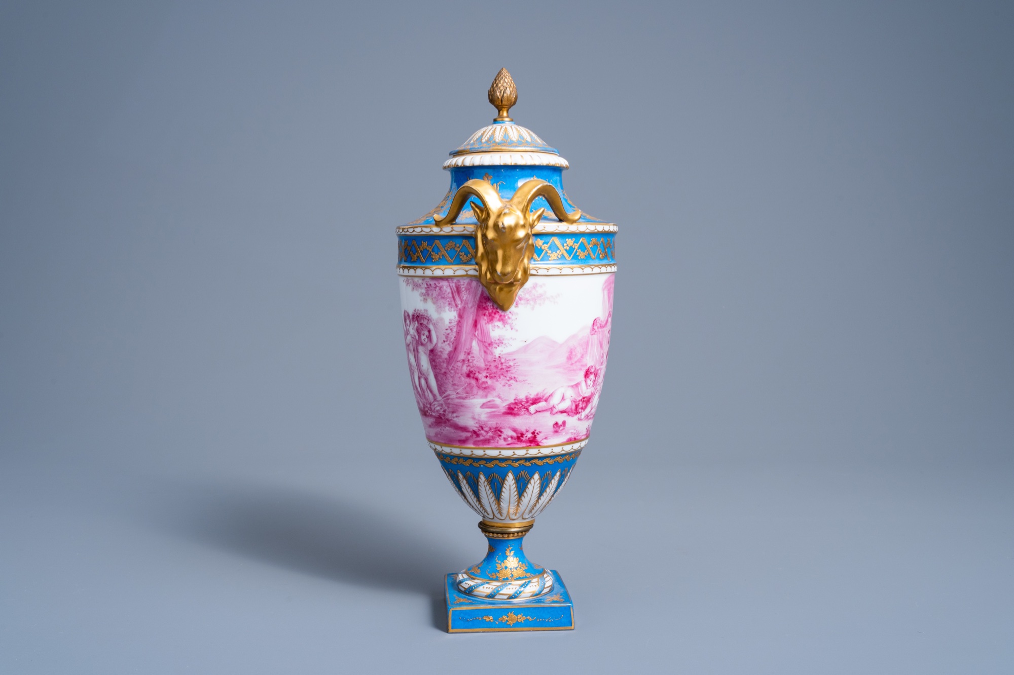 A French gold layered 'bleu celeste' ground vase and cover with putti in a landscape and ram's heads - Image 4 of 7
