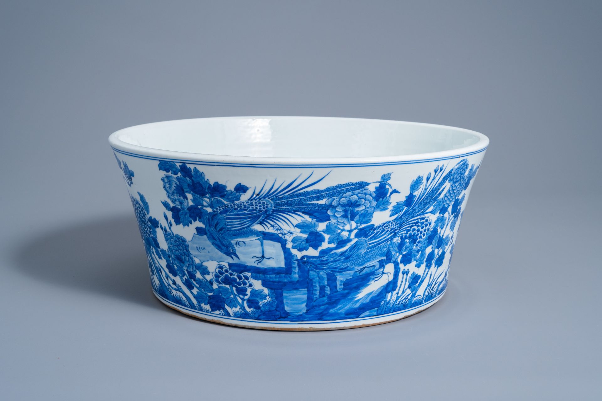 A large Chinese blue and white basin with pheasants in a landscape, 20th C