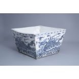 A large Chinese blue and white square 'sea dragon' jardinire, 19th/20th C.