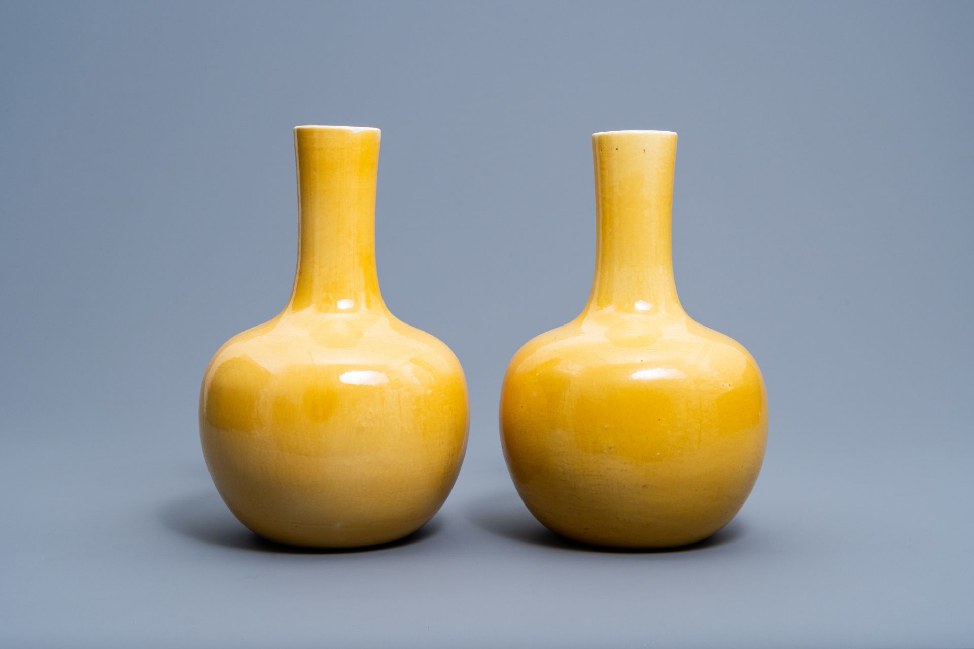 A pair of Chinese monochrome yellow tianqu ping vases, 20th C.