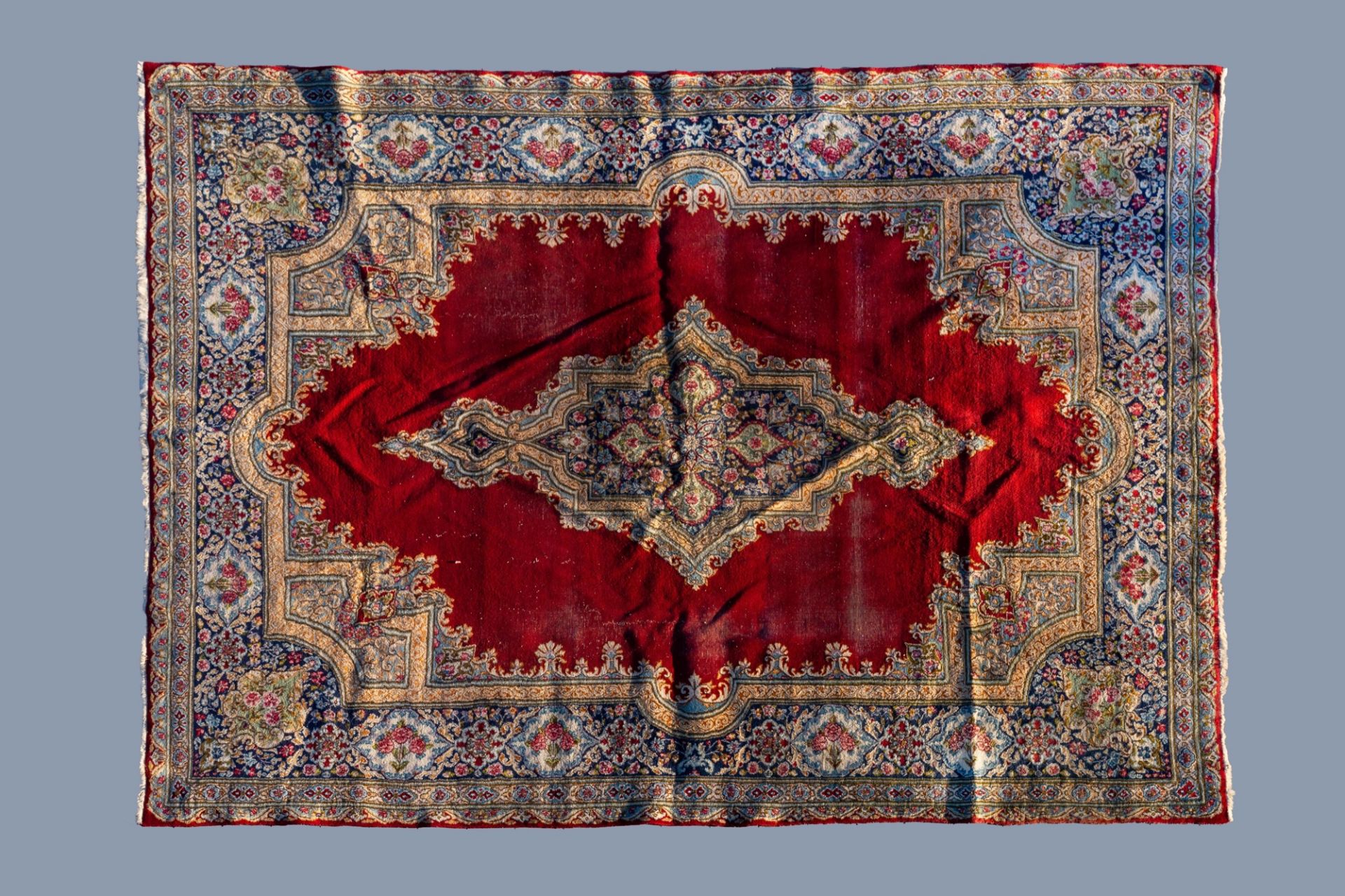 A Persian Mashad rug with floral design, wool on cotton, 20th C.