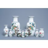 Nine Chinese famille rose vases with birds among blossoming branches and a figure in a garden, 20th