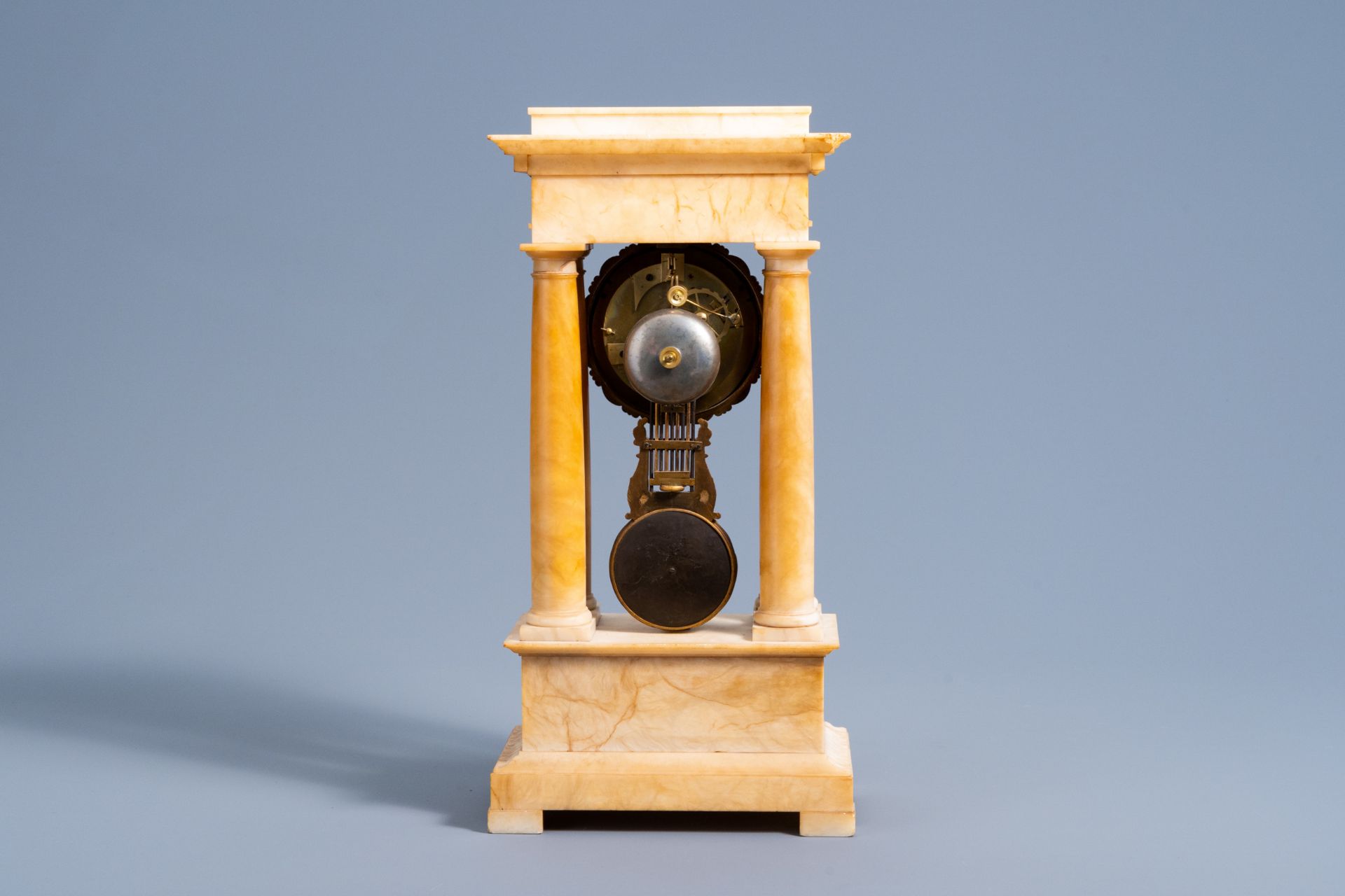 A French bronze and alabaster column mantel clock with floral design, 19th C. - Image 4 of 11