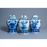 Three Chinese blue and white vases and covers with floral design, 19th/20th C.