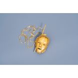Bernard Vandenberghe (20th C.): A necklace with a gilt mask pendant
