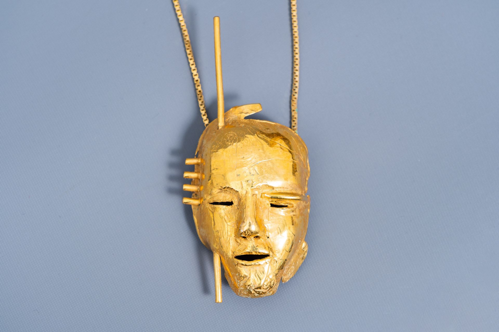 Bernard Vandenberghe (20th C.): A necklace with a gilt mask pendant - Image 4 of 5