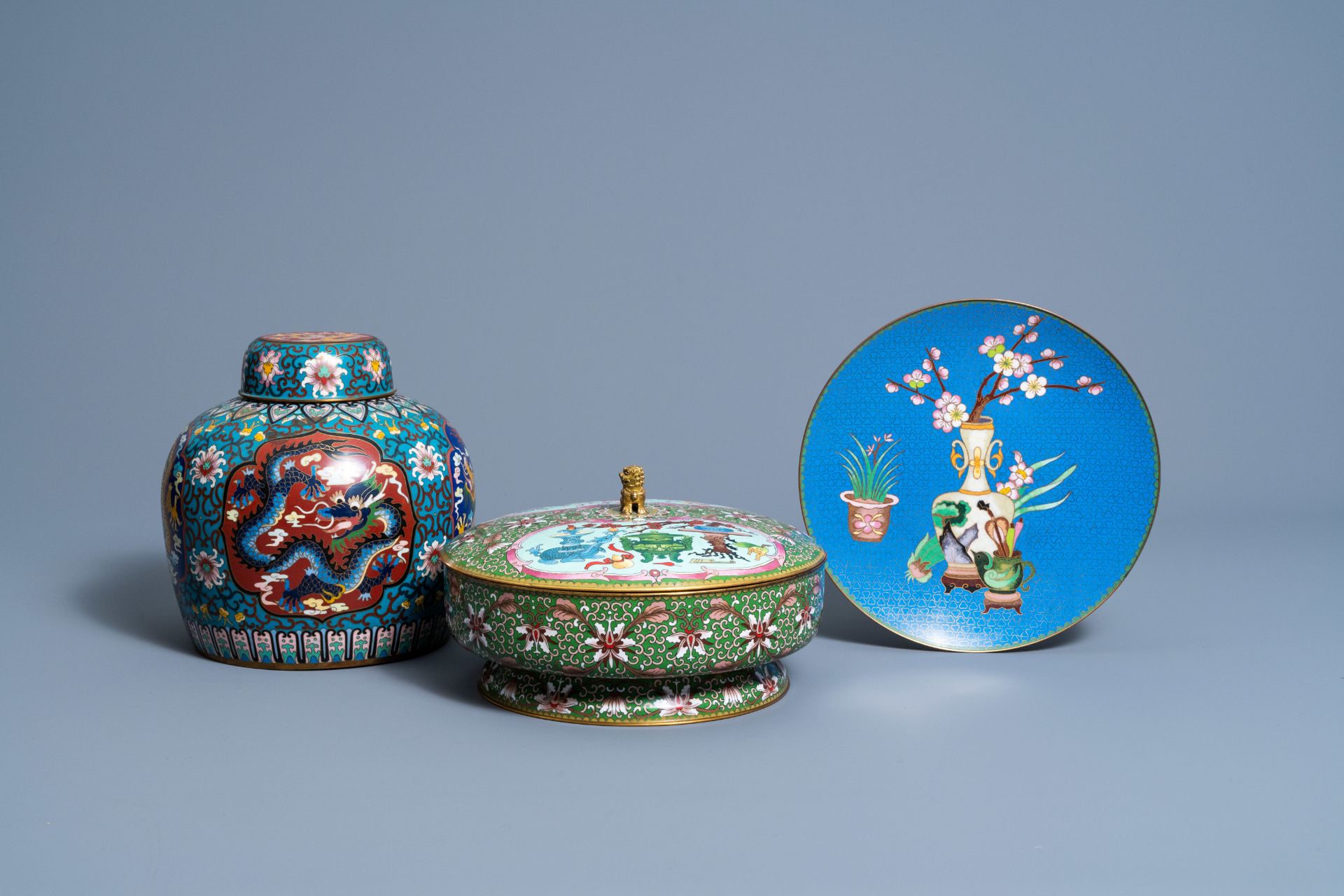 Two Chinese cloisonnŽ jars and covers and a 'flower vases' plate, 20th C.