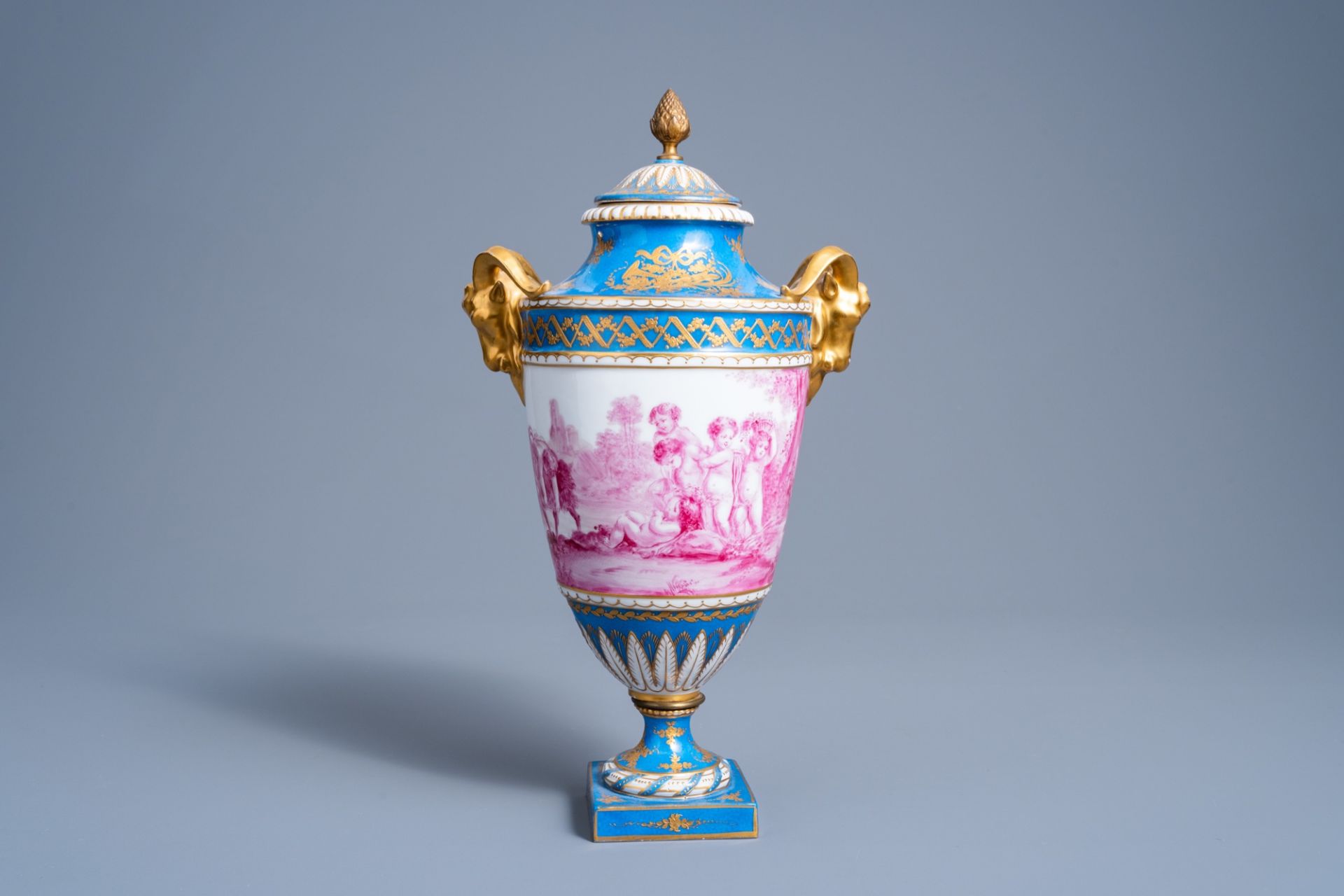 A French gold layered 'bleu celeste' ground vase and cover with putti in a landscape and ram's heads - Image 3 of 7