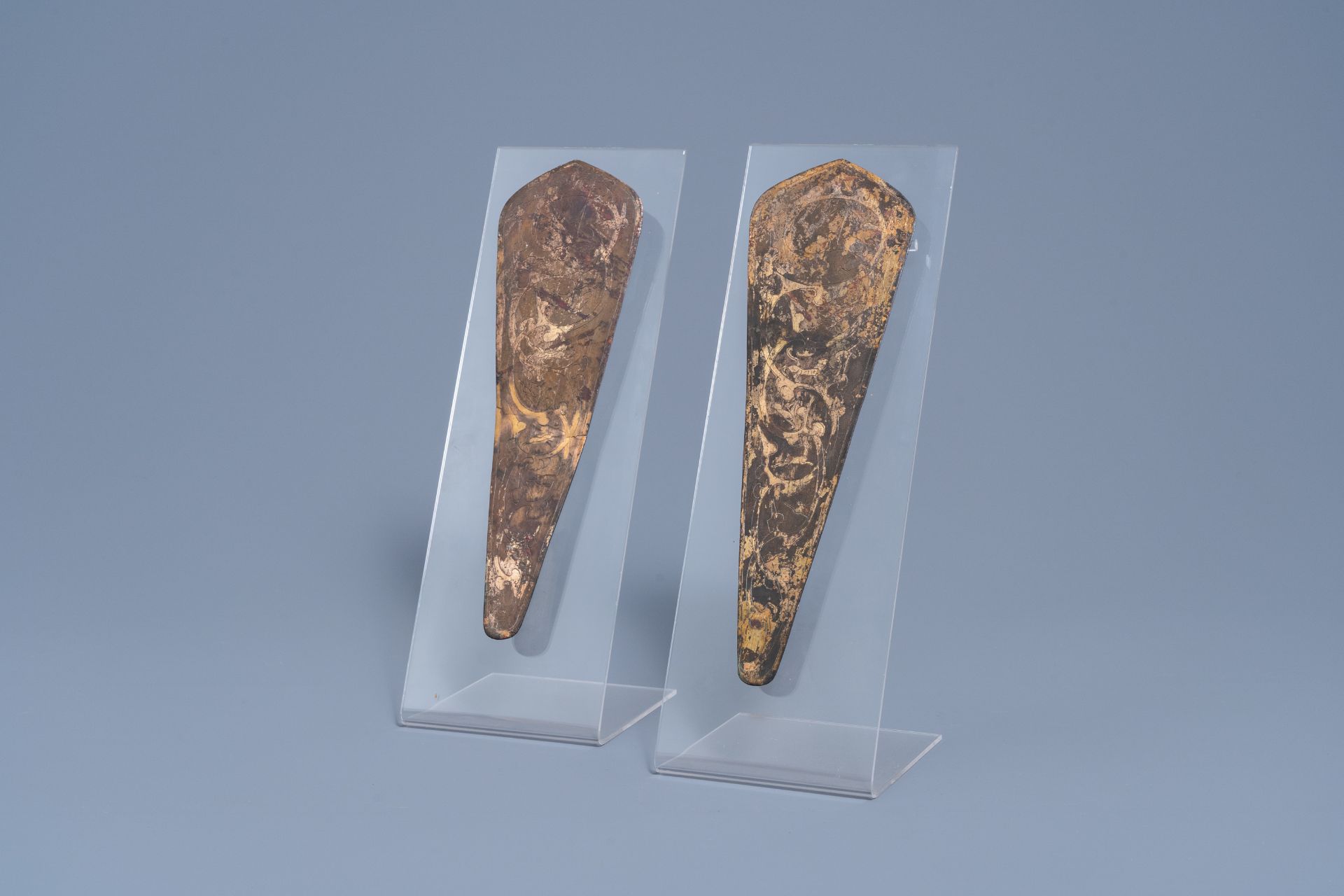 A pair of Chinese gilt bronze chamfrons or forehead protectors for a horse with engraved animal desi