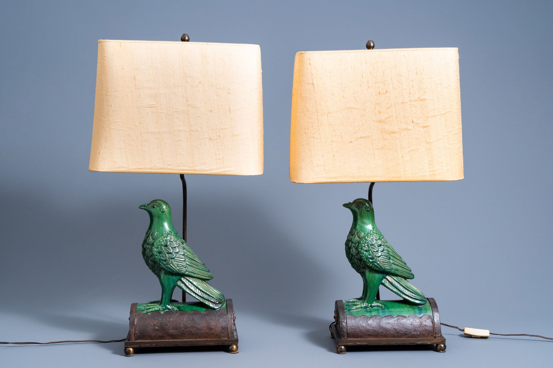 A pair of Chinese bird-shaped roof tiles mounted as lamps, 19th/20th C.