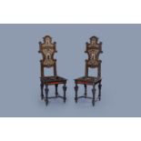 A pair of Italian ebonised wood chairs with tortoiseshell inlay and with Pallas Athena, 19th C.