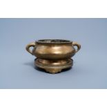 A Chinese bronze censer and cover on stand, Xuande mark, 19th C.