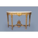 A large French Louis XVI style gilt and patinated wood console with marble top, 19th C.