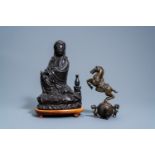 A Chinese bronze figure of Guanyin and a horse, 19th/20th C.