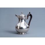 A Belgian silver coffee pot and cover, 800/000, Brussels, maker's mark 'Louis Wolfers pre et fils',