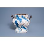 A Brussels white and blue glazed faience portable stove or 'brasero' with wood handles, 18th/19th C.