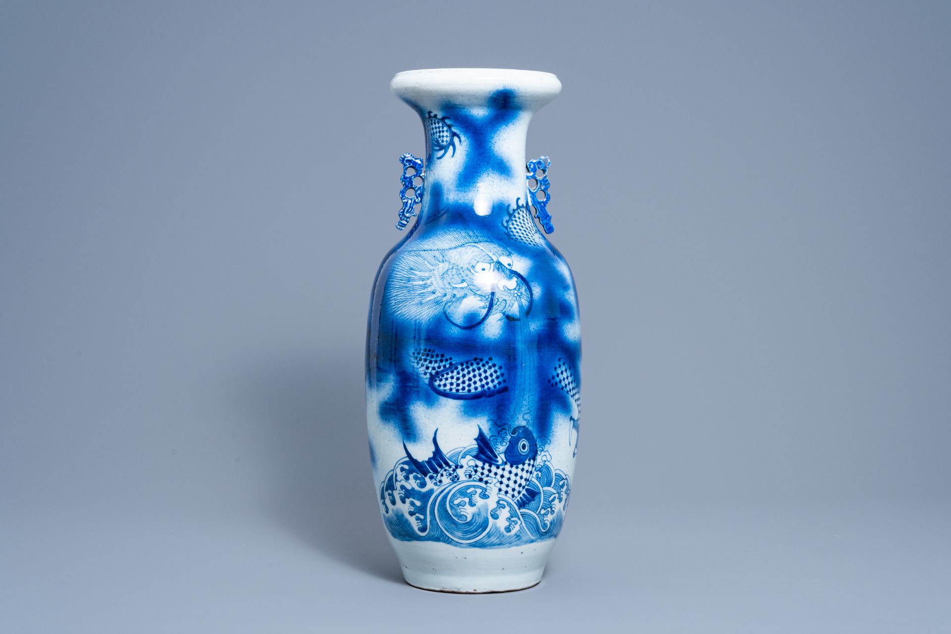 A Chinese blue and white 'dragon and carp' vase, 19th C.