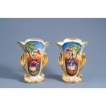 A pair of gilt and polychrome old Paris porcelain vases with floral relief and chinoiserie design, d