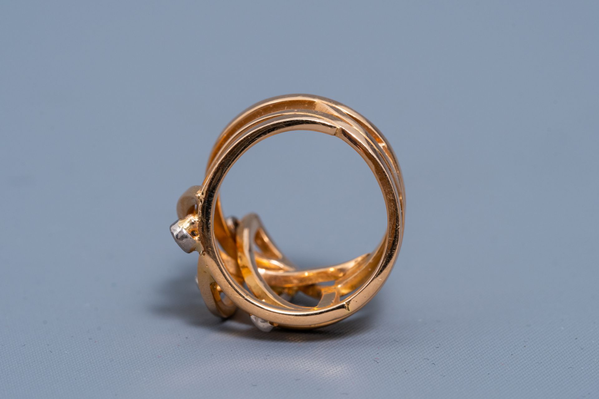 An 18 carat yellow and white gold ring set with six diamonds, 20th C. - Image 4 of 7