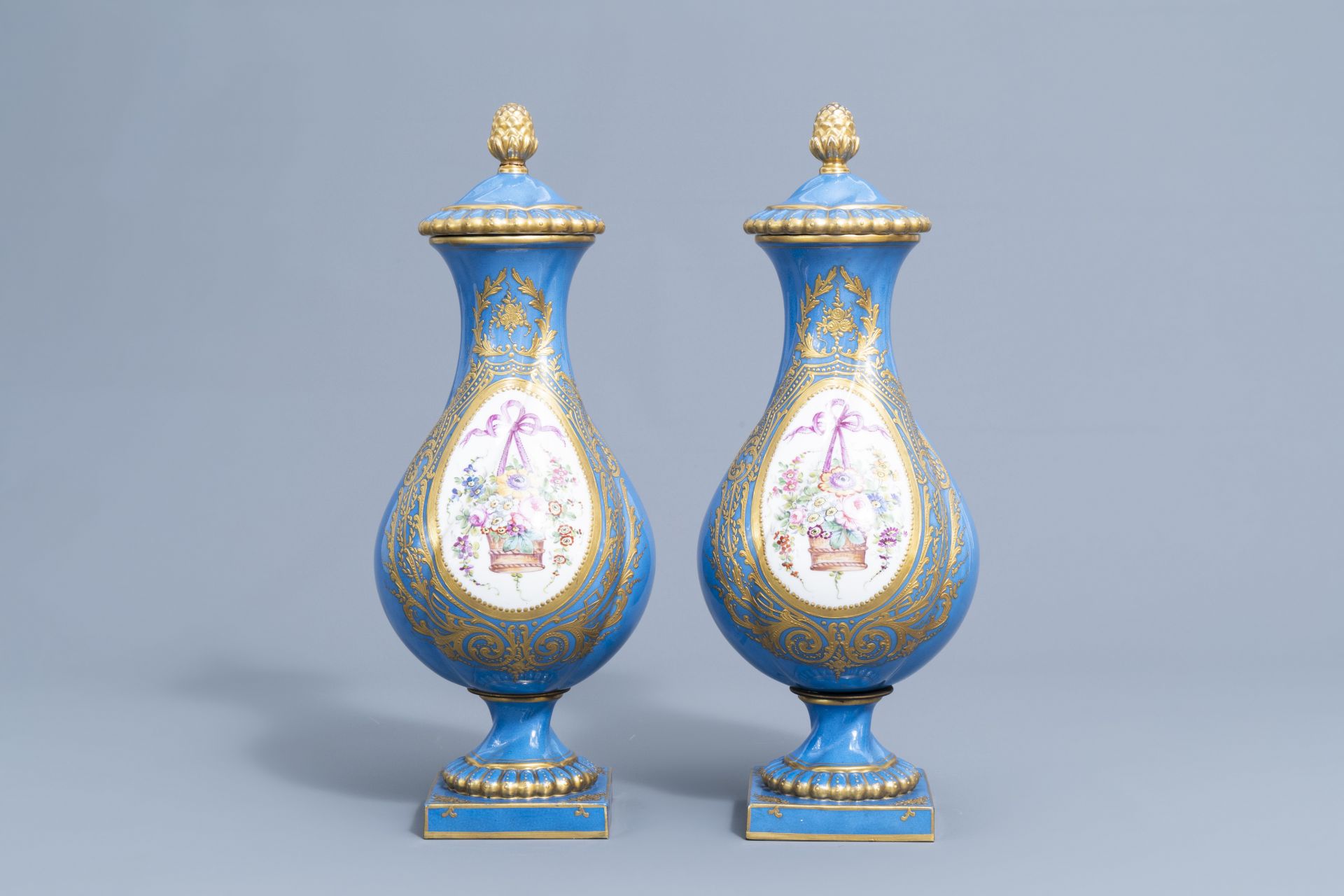 A pair of French gold layered 'bleu celeste' ground vases and covers in the Svres manner and an Emp - Image 2 of 14