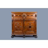 A Dutch oak wood cupboard 'Zeeuwse kast' with geometric pattern, flanked by lions and ebony and rose