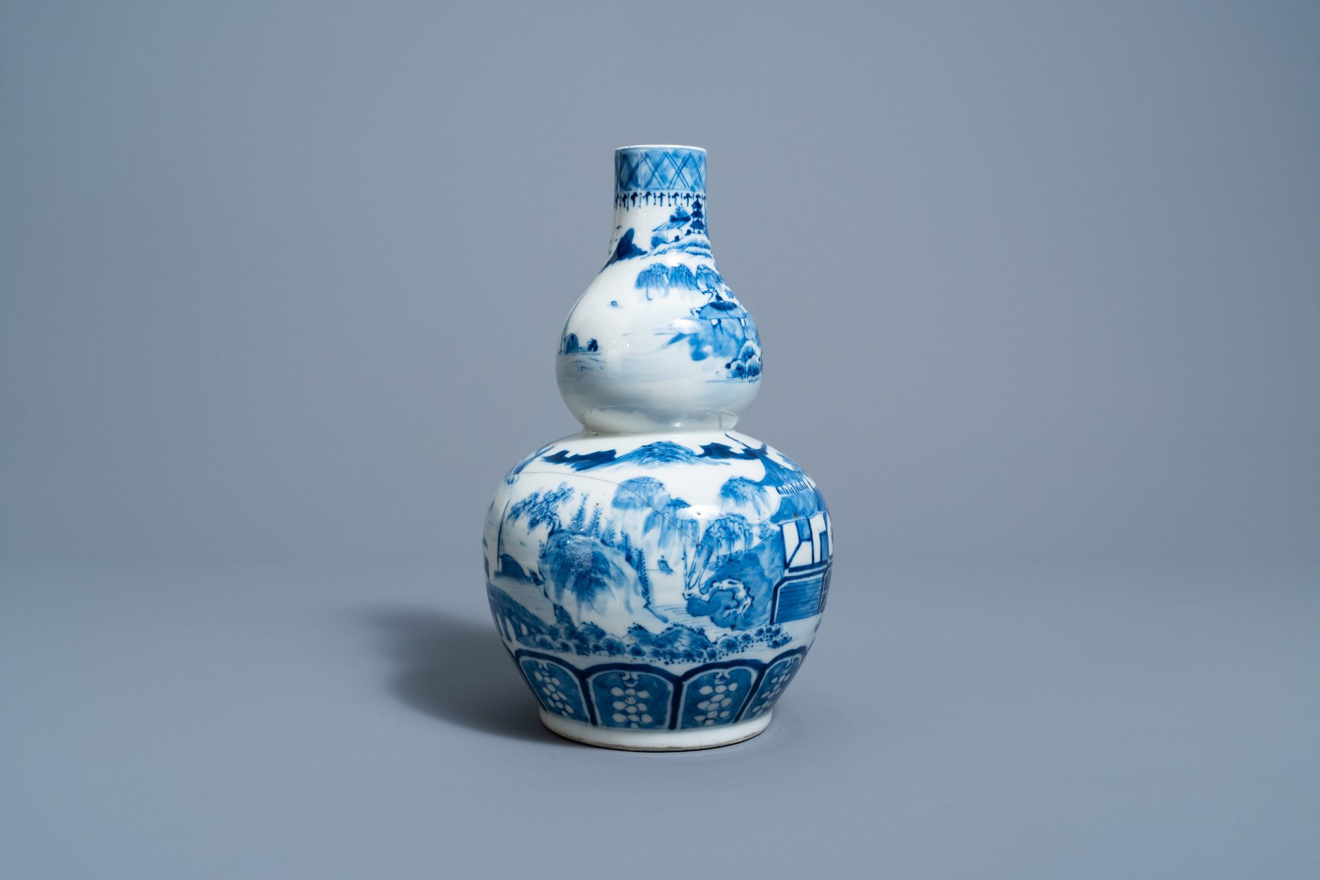 A Chinese blue and white double gourd 'landscape' vase, 19th C. - Image 4 of 6