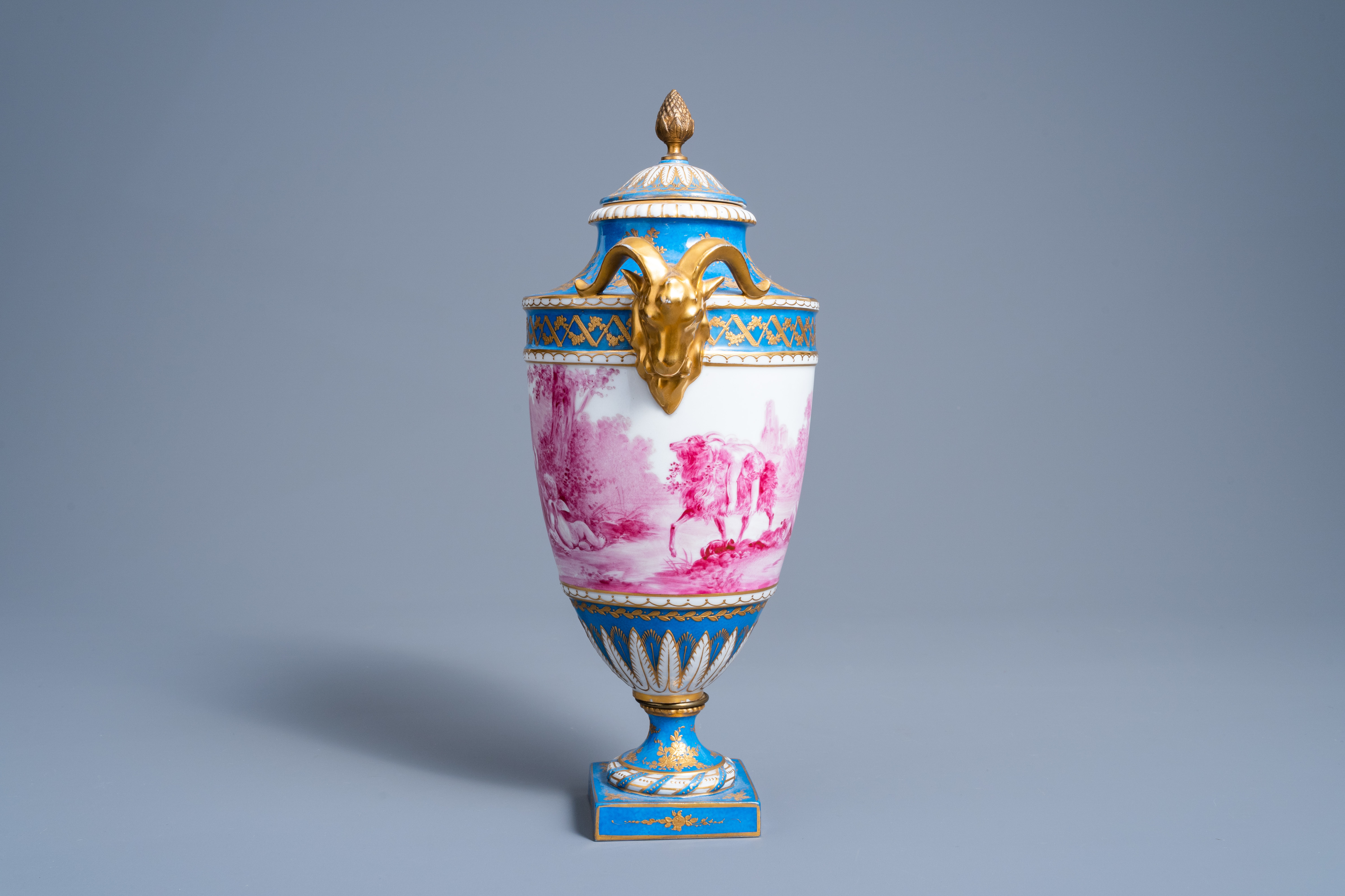 A French gold layered 'bleu celeste' ground vase and cover with putti in a landscape and ram's heads - Image 2 of 7