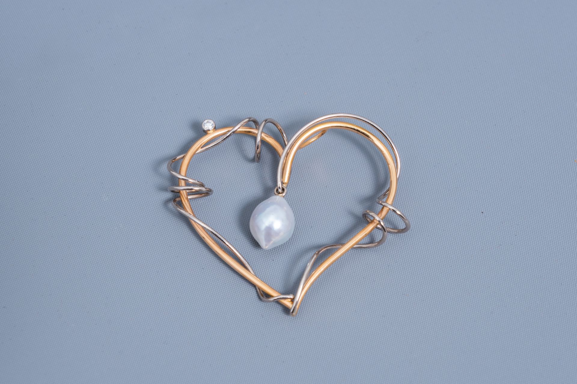 An 18 carat white and yellow heart-shaped pendant set with a diamond and a white South Sea pearl, 20 - Image 2 of 3