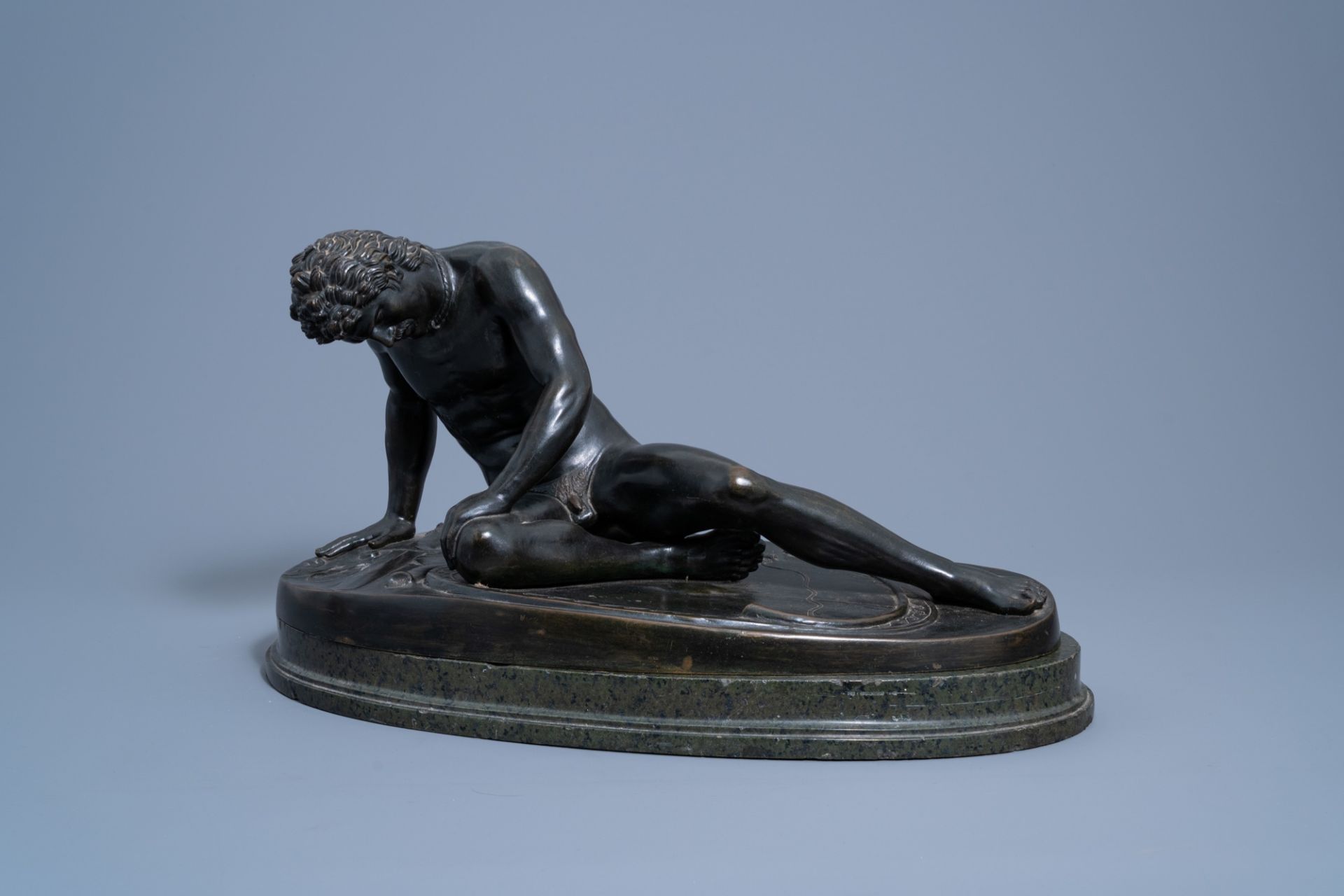 After the antique: The Dying Gaul, patinated bronze on a vert de mer marble base, 19th/20th C.