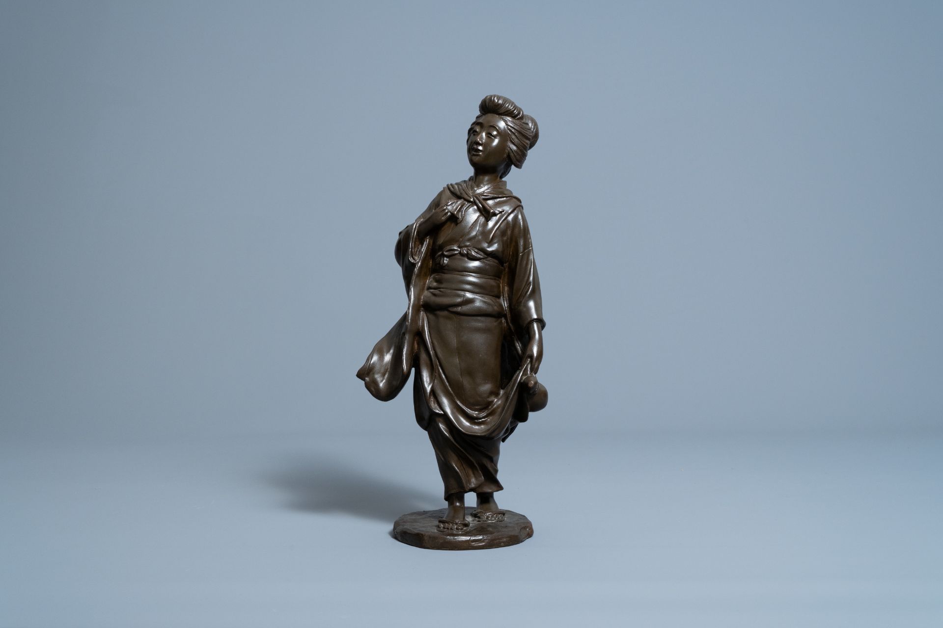 A Japanese bronze okimono of a lady with a gourd, signed Seiya, Meiji, 19th C. - Image 3 of 10