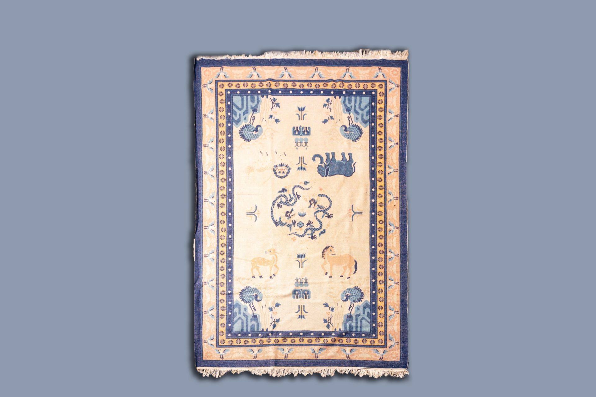 A Chinese woolen 'Beijing' pictorial animal rug with a blue elephant, first quarter of the 20th C. - Image 2 of 3