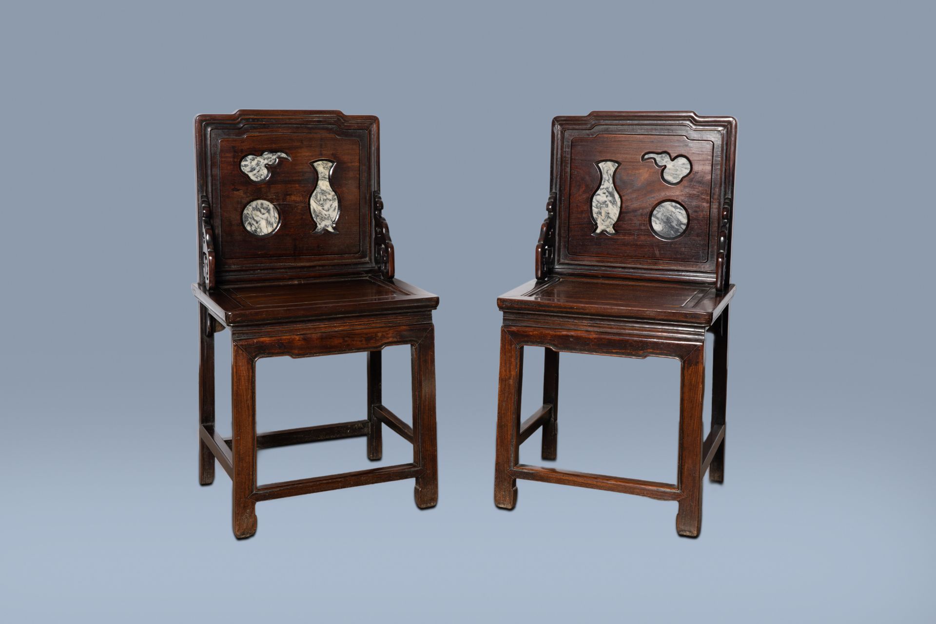 A pair of Chinese wood chairs with dreamstone plaques, 19th/20th C.