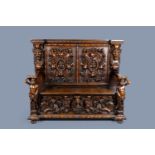 An Italian richly carved wood chest or settle with atlantes and grotesques, 19th C.