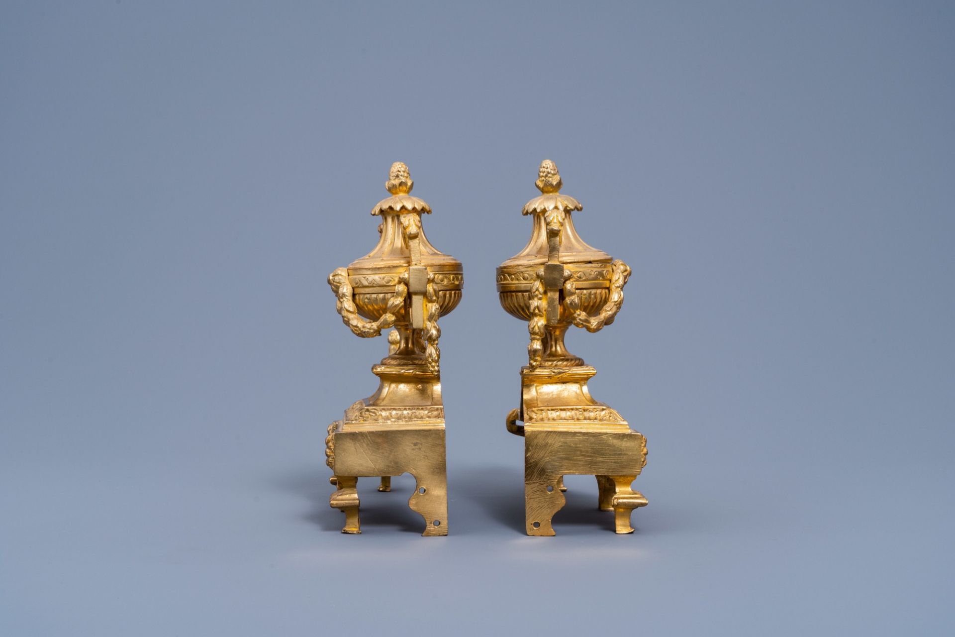 A pair of French Louis XVI style gilt bronze chenets and fire fender, 19th/20th C. - Image 4 of 11