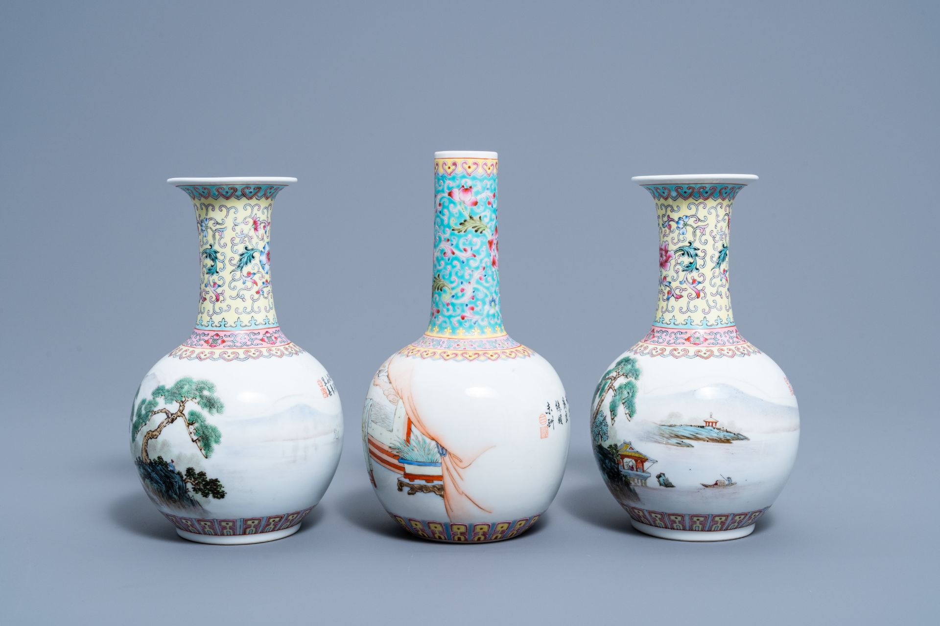A pair of Chinese bottle shaped famille rose vases with an animated landscape and a vase with figura - Bild 2 aus 6